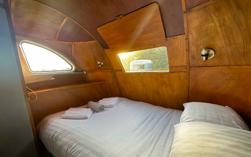 The double bedroom in Bing with unusual curved windows and wooden surround